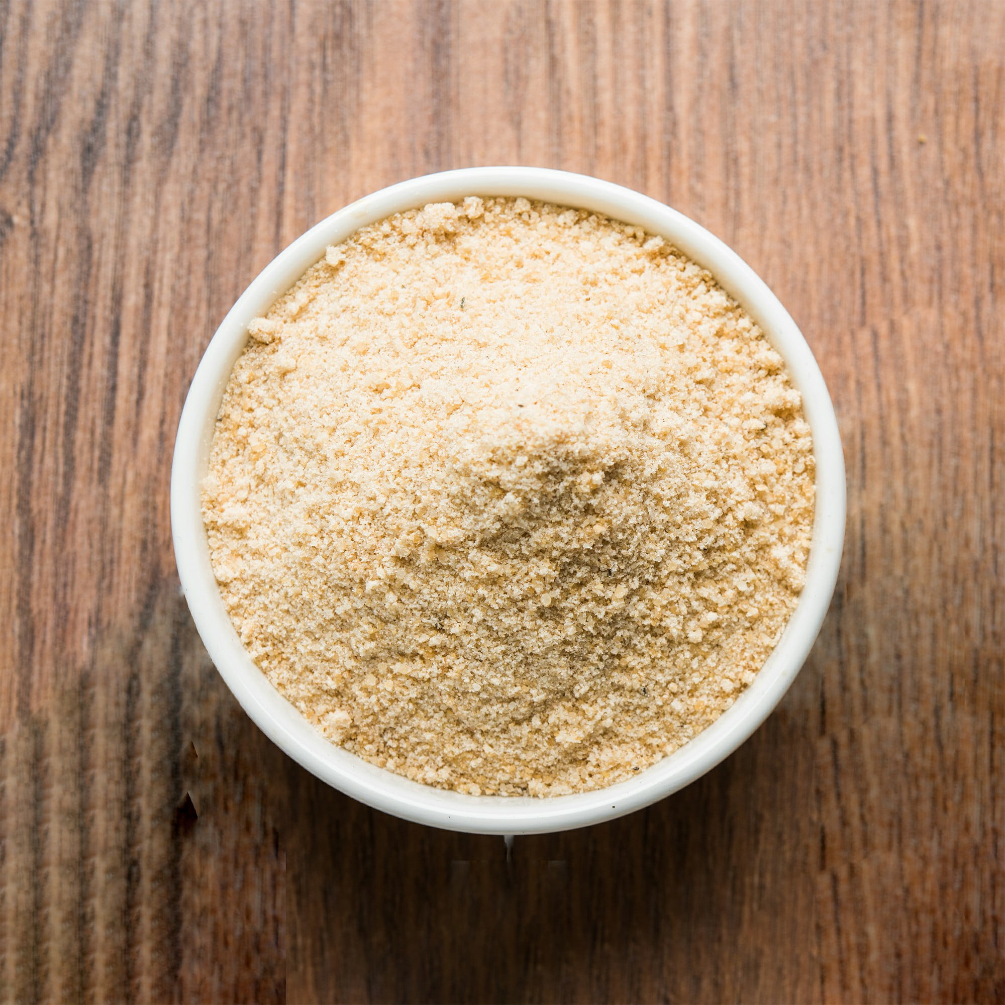 Hing OR Asafoetida cake and Powder which is an important ingredient in Indian food recipes. Over moody background. , selective focus